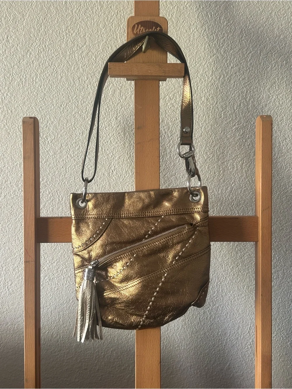 b. makowsky Metallic Gold Crossbody with Tassel Accent